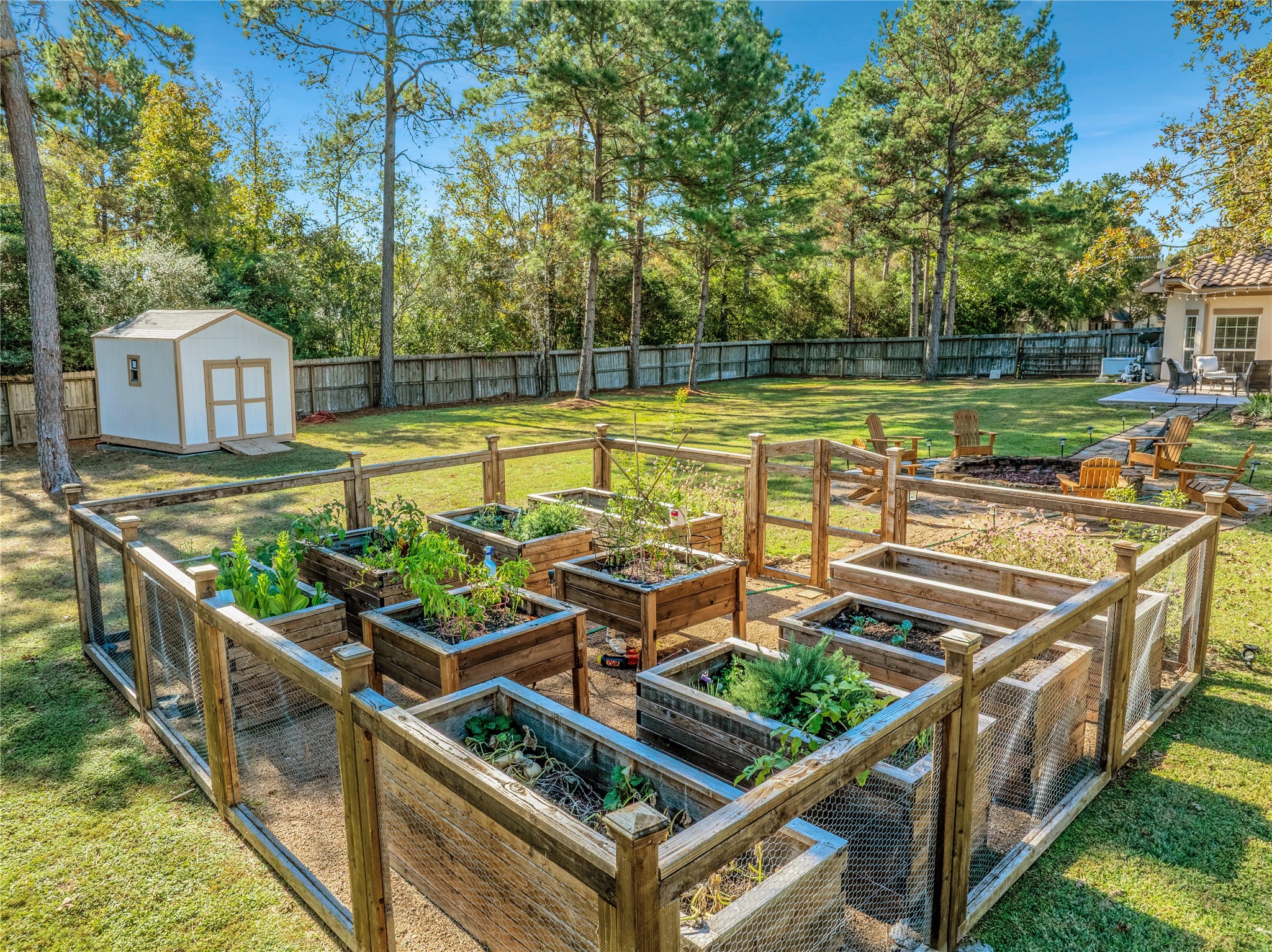 26122 Crown Ranch Boulevard Montgomery, TX 77316 - Photo 30 of 31 a view of a house with swimming pool and a chairs