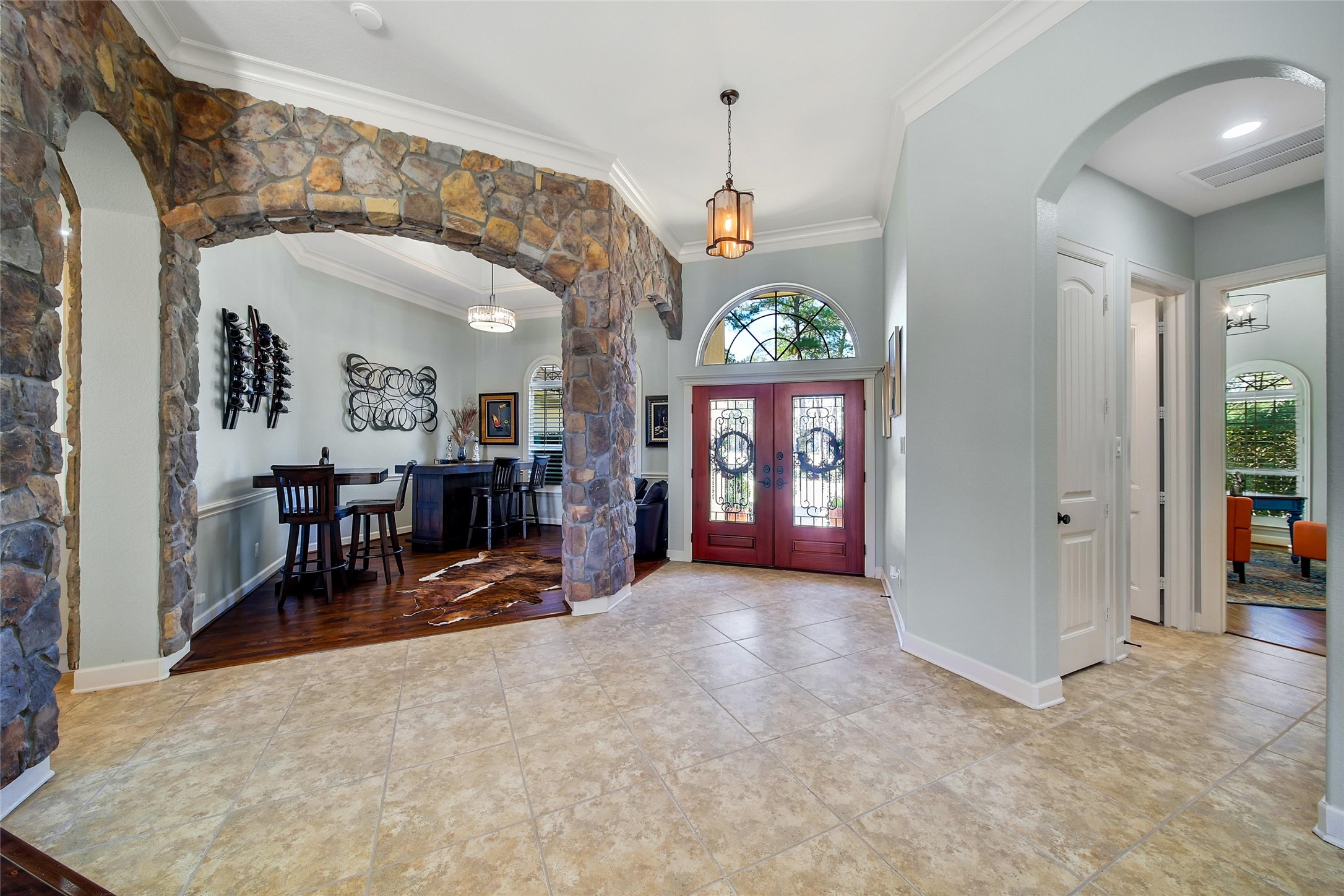 26122 Crown Ranch Boulevard Montgomery, TX 77316 - Photo 4 of 31 an entryway and a livingroom with furniture