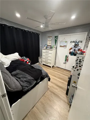a bedroom with a bed and a walk in closet