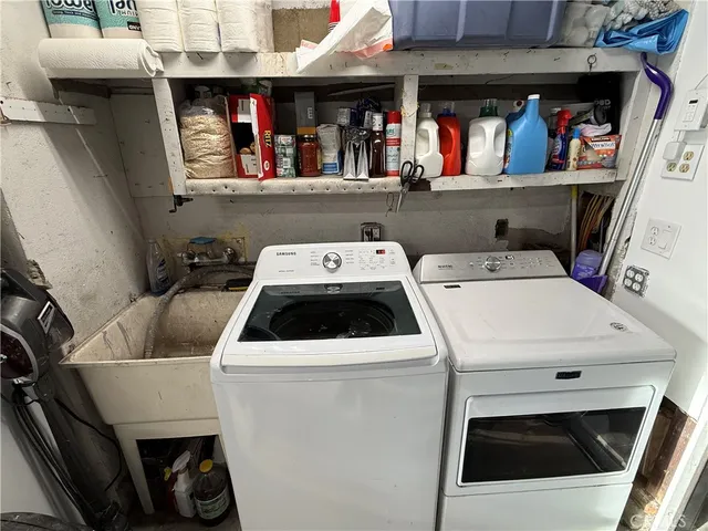 a utility room with dryer washer and closet