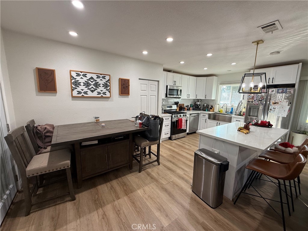 12042 Hackamore Road Garden Grove, CA 92840 - Photo 3 of 20 a view of a dining room with furniture