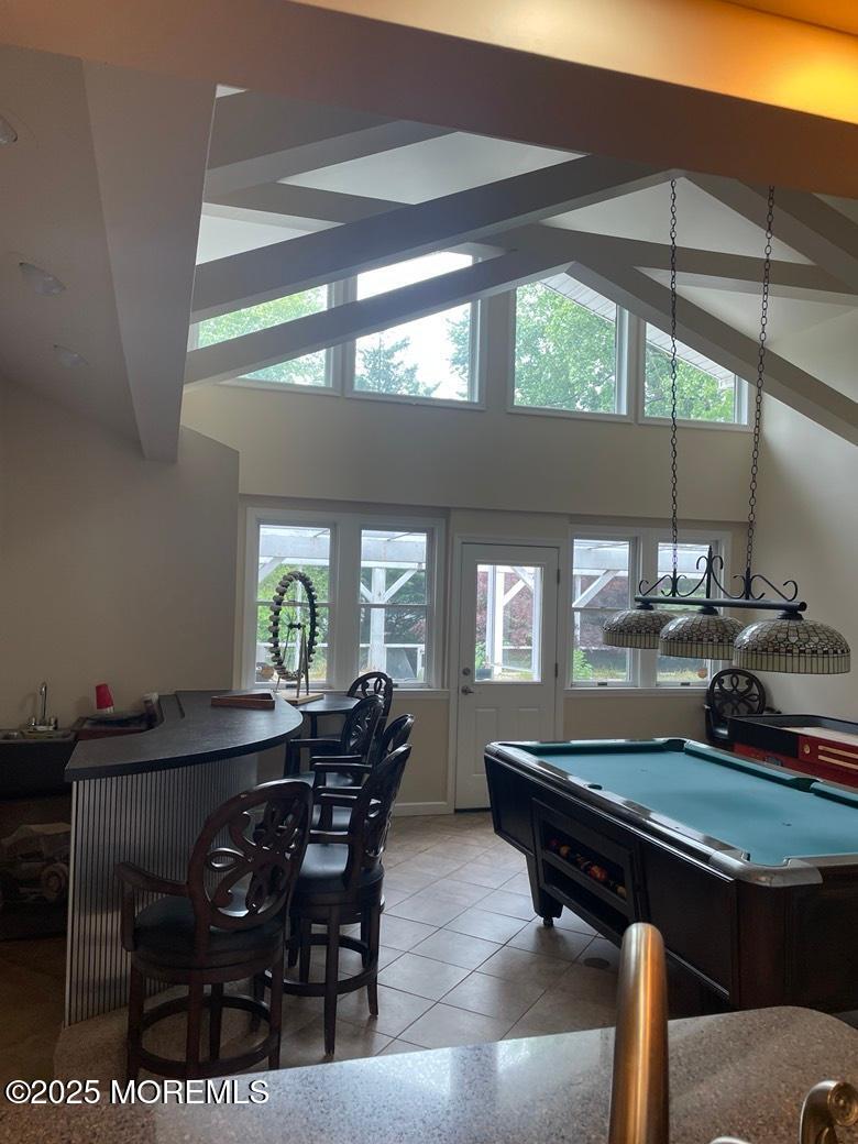 470 Monmouth Place Long Branch, NJ 07740 - Photo 12 of 25 a kitchen with a table chairs and wooden floor