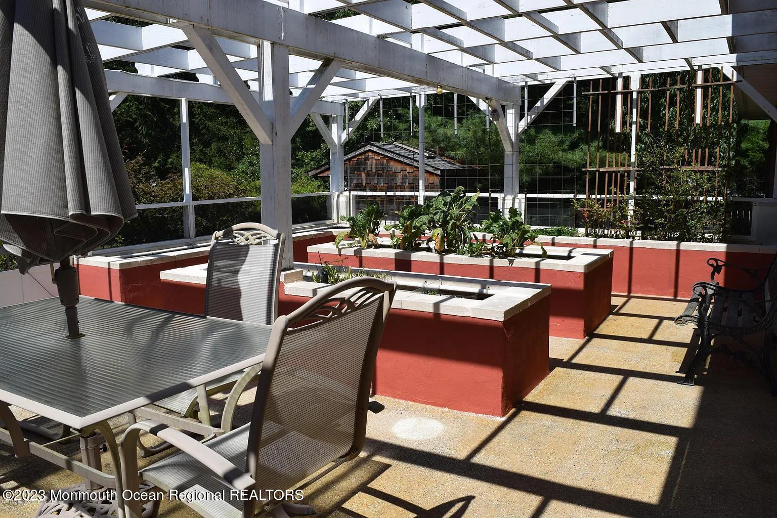 470 Monmouth Place Long Branch, NJ 07740 - Photo 13 of 25 a view of a patio with couches table and chairs