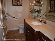 470 Monmouth Place Long Branch, NJ 07740 - Photo 14 of 25 a bathroom with a sink and a mirror