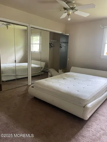 a bedroom with a bed and closet