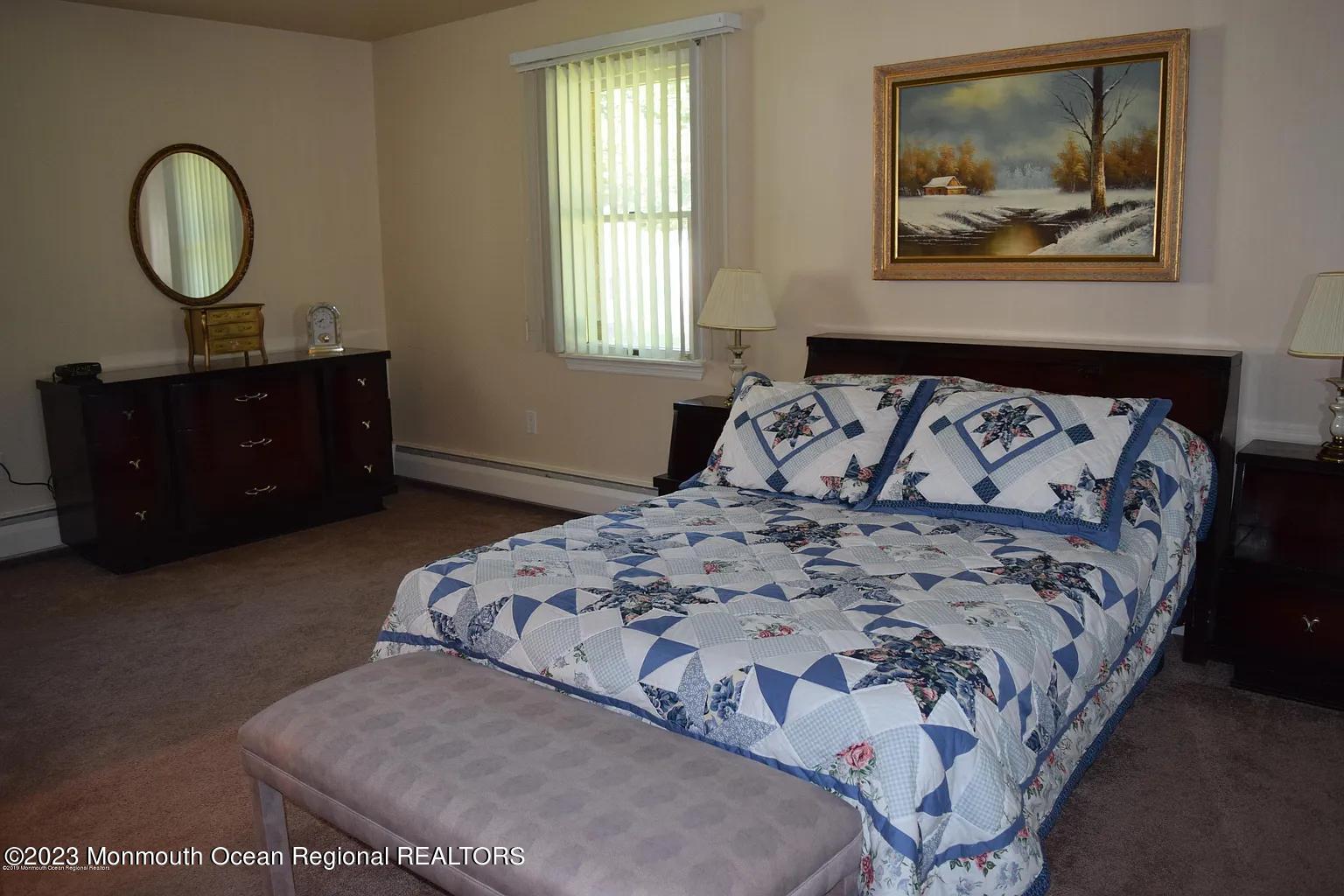 470 Monmouth Place Long Branch, NJ 07740 - Photo 18 of 25 a bedroom with a bed and a painting on the wall