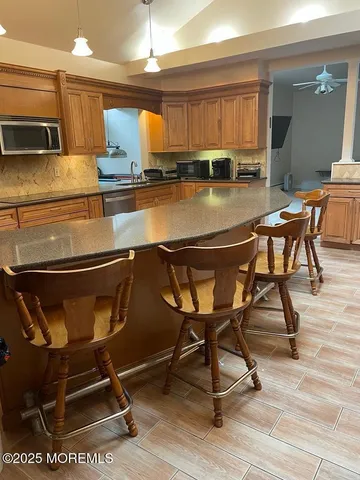 a kitchen with a sink cabinets and window