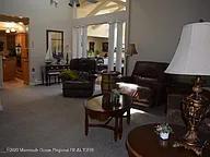 470 Monmouth Place Long Branch, NJ 07740 - Photo 8 of 25 a living room with furniture and a lamp