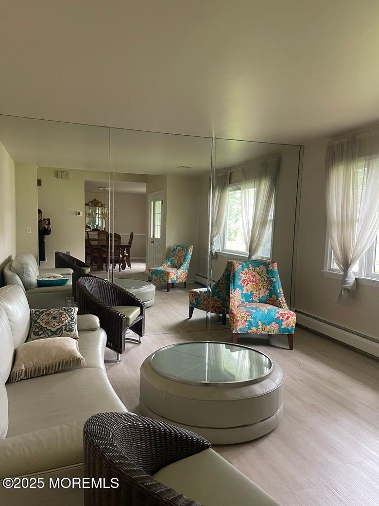 470 Monmouth Place Long Branch, NJ 07740 - Photo 9 of 25 a living room with furniture and a wooden floor
