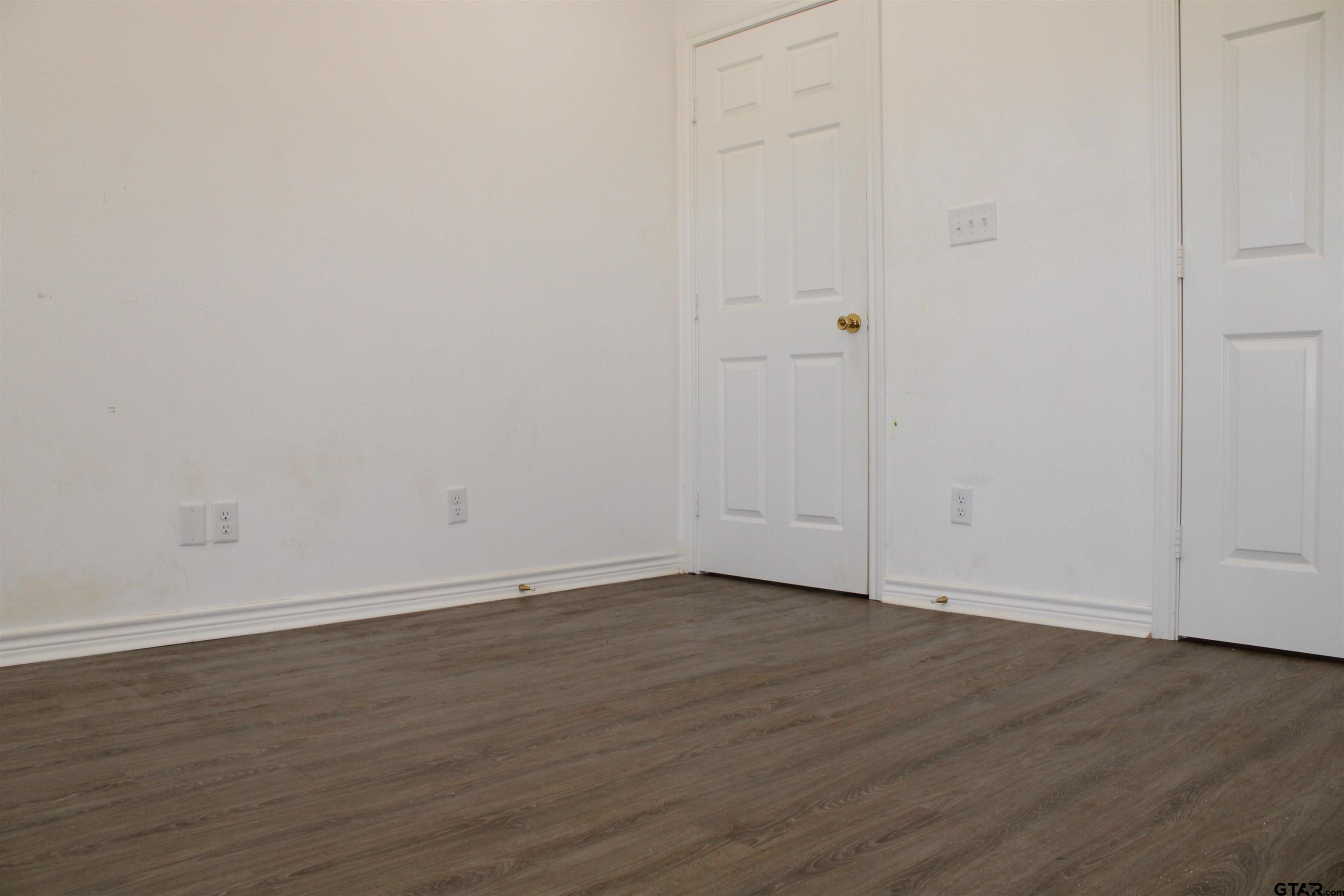 14965 Turtle Crk Rnch Road Flint, TX 75762 - Photo 14 of 26 a view of an empty room with wooden floor