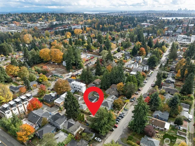 an aerial view of residential house with outdoor space and city view