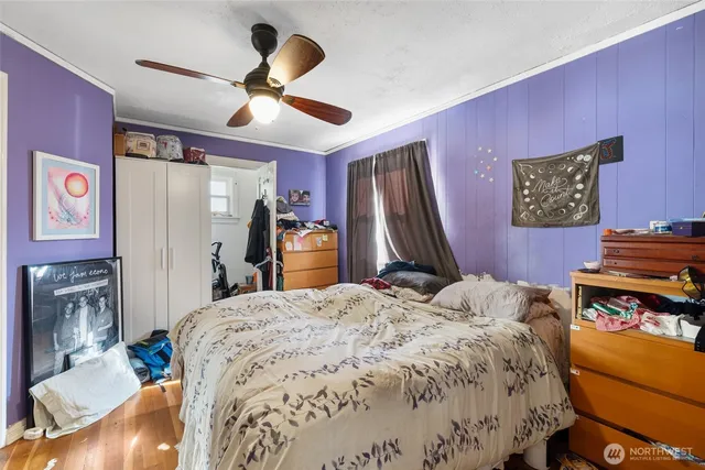 a bed room with a bed and a television