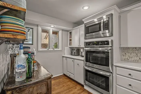 a kitchen with appliances cabinets and a sink