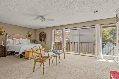 a bedroom with furniture and a window