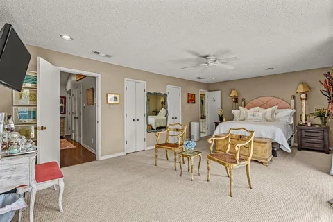 a living room with furniture and flat screen tv