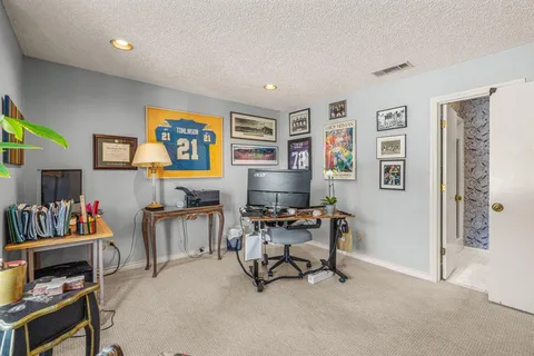 a workspace with furniture and window