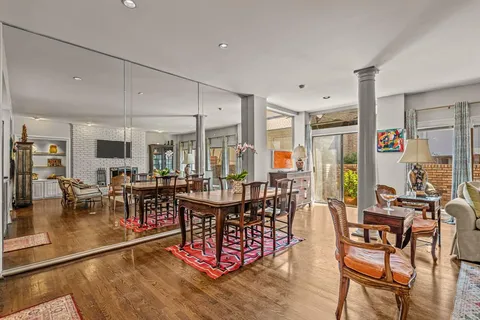 a view of a dining room with furniture window and outside view