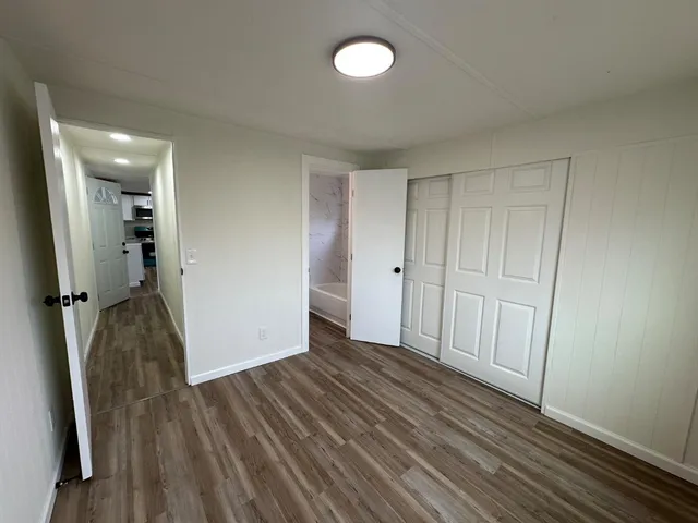 a bathroom with a shower a toilet and sink