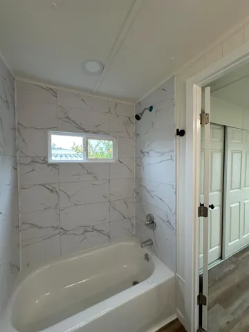 a bathroom with a sink toilet and mirror