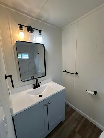 a bathroom with a toilet a sink and a bathtub