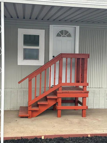 a backyard of a house with outdoor seating