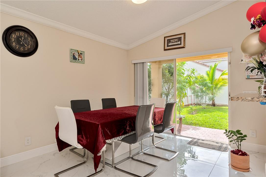 833 Falling Water Road Weston, FL 33326 - Photo 7 of 32 a view of a livingroom with furniture and a window