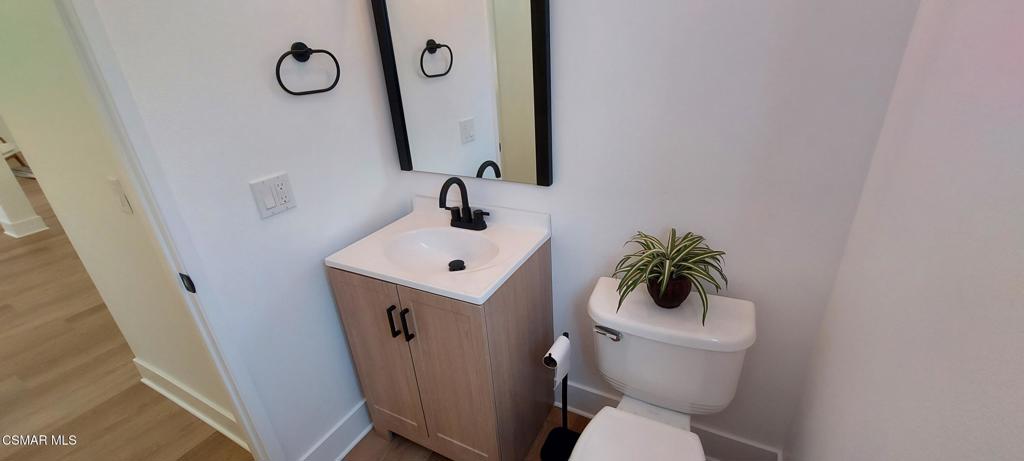 3477 Vicki Court Simi Valley, CA 93063 - Photo 14 of 23 a bathroom with a toilet sink and mirror