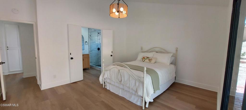 3477 Vicki Court Simi Valley, CA 93063 - Photo 9 of 23 a bedroom with a bed and wooden floor