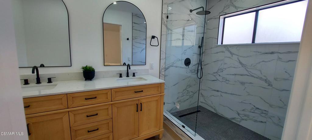 3477 Vicki Court Simi Valley, CA 93063 - Photo 10 of 23 a bathroom with a sink a vanity and a mirror