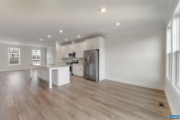 a view of kitchen with wooden floor and window