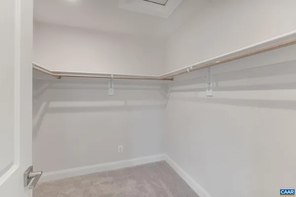 a view of an empty walk in closet