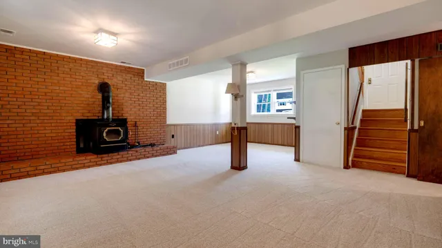 a view of a livingroom with furniture and a flat screen tv