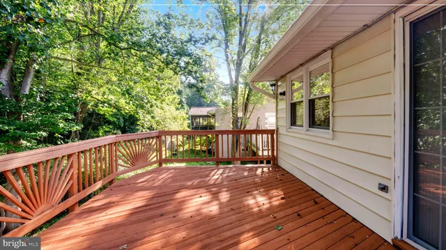 a view of a balcony with wooden floor