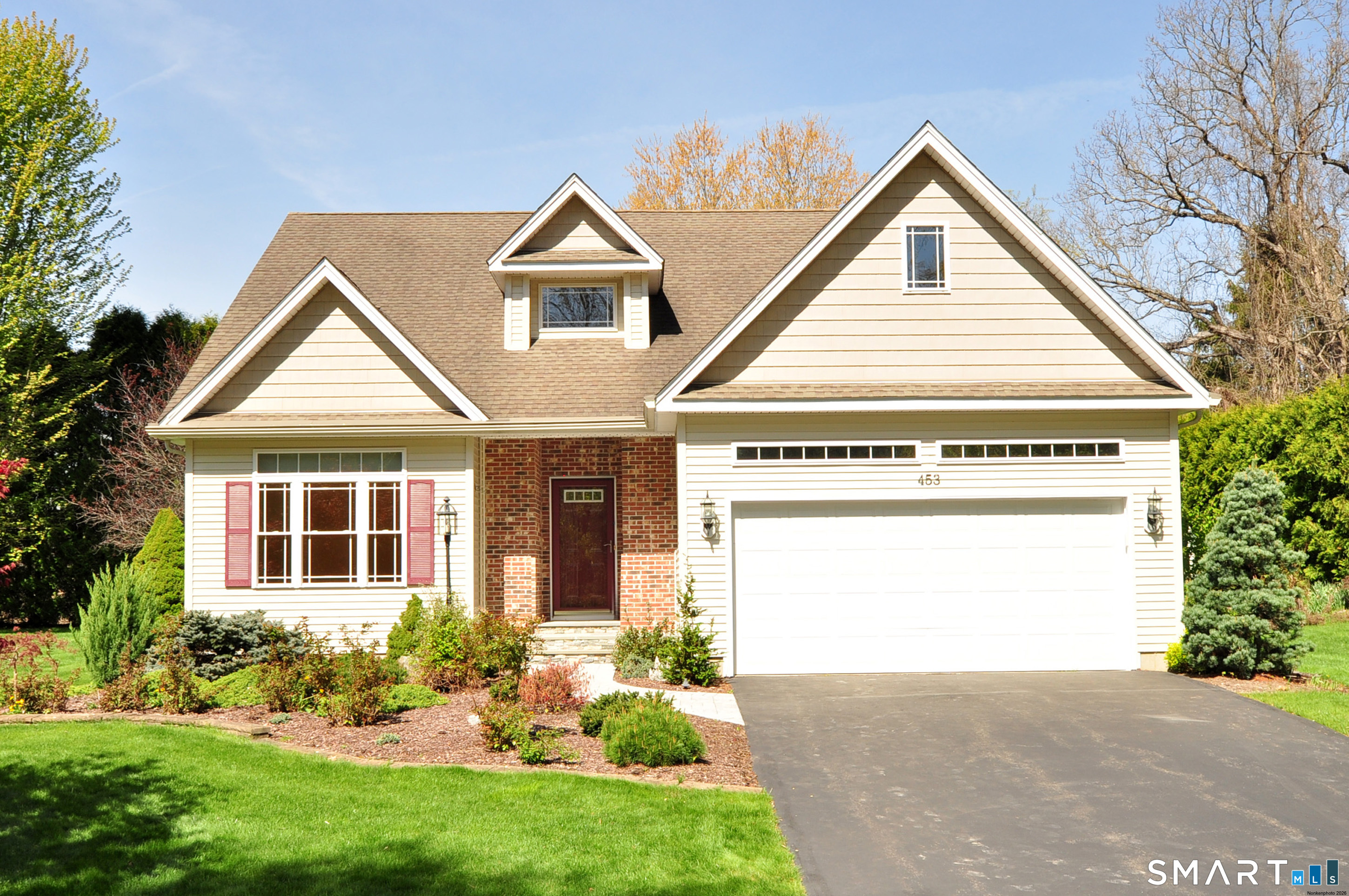 453 Tributary Lane Windsor, CT 06095 - Photo 1 of 37 a view of a house with a yard and garden