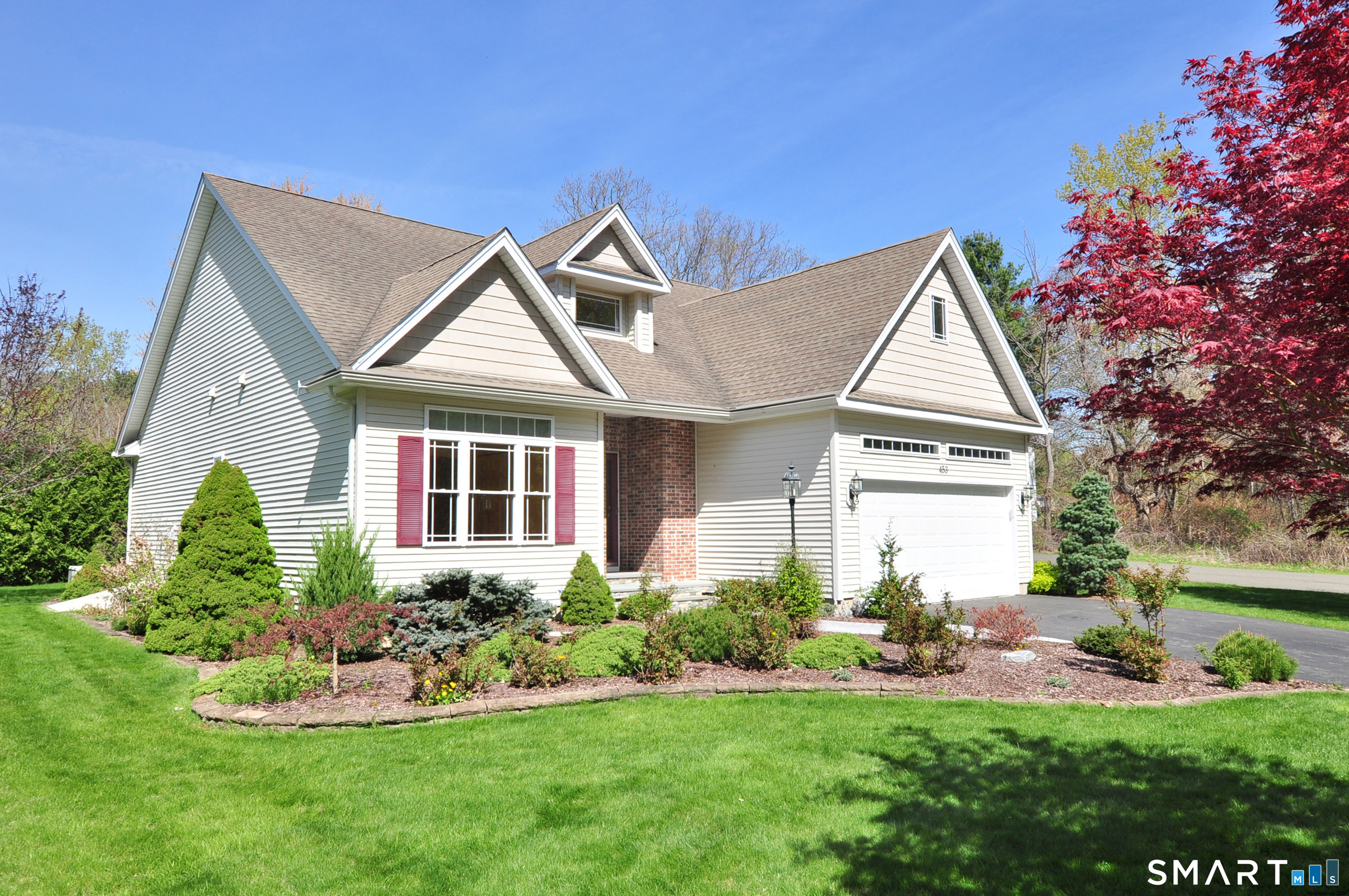 453 Tributary Lane Windsor, CT 06095 - Photo 2 of 37 a front view of a house with a yard