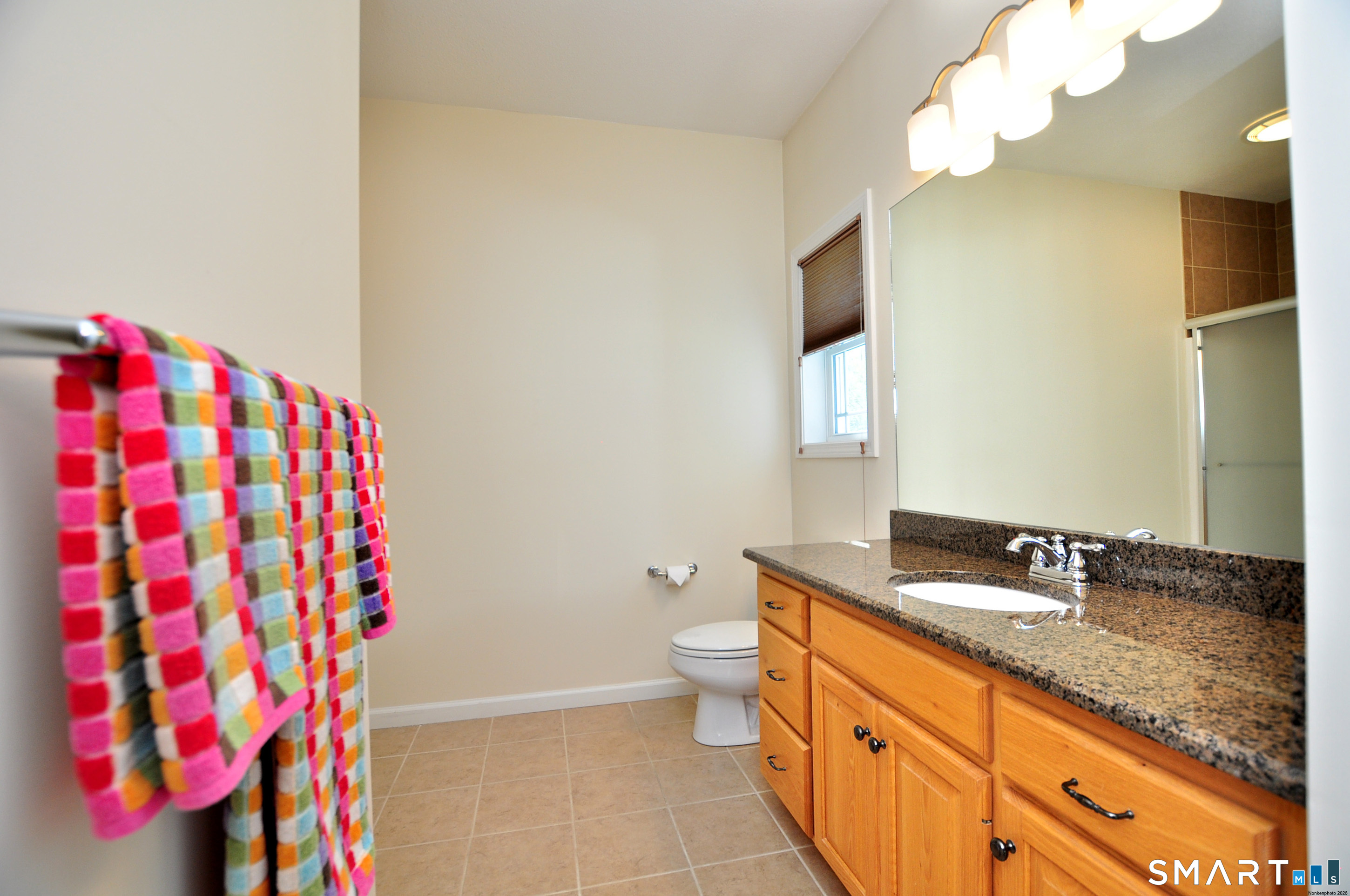 453 Tributary Lane Windsor, CT 06095 - Photo 25 of 37 a bathroom with a sink and a mirror