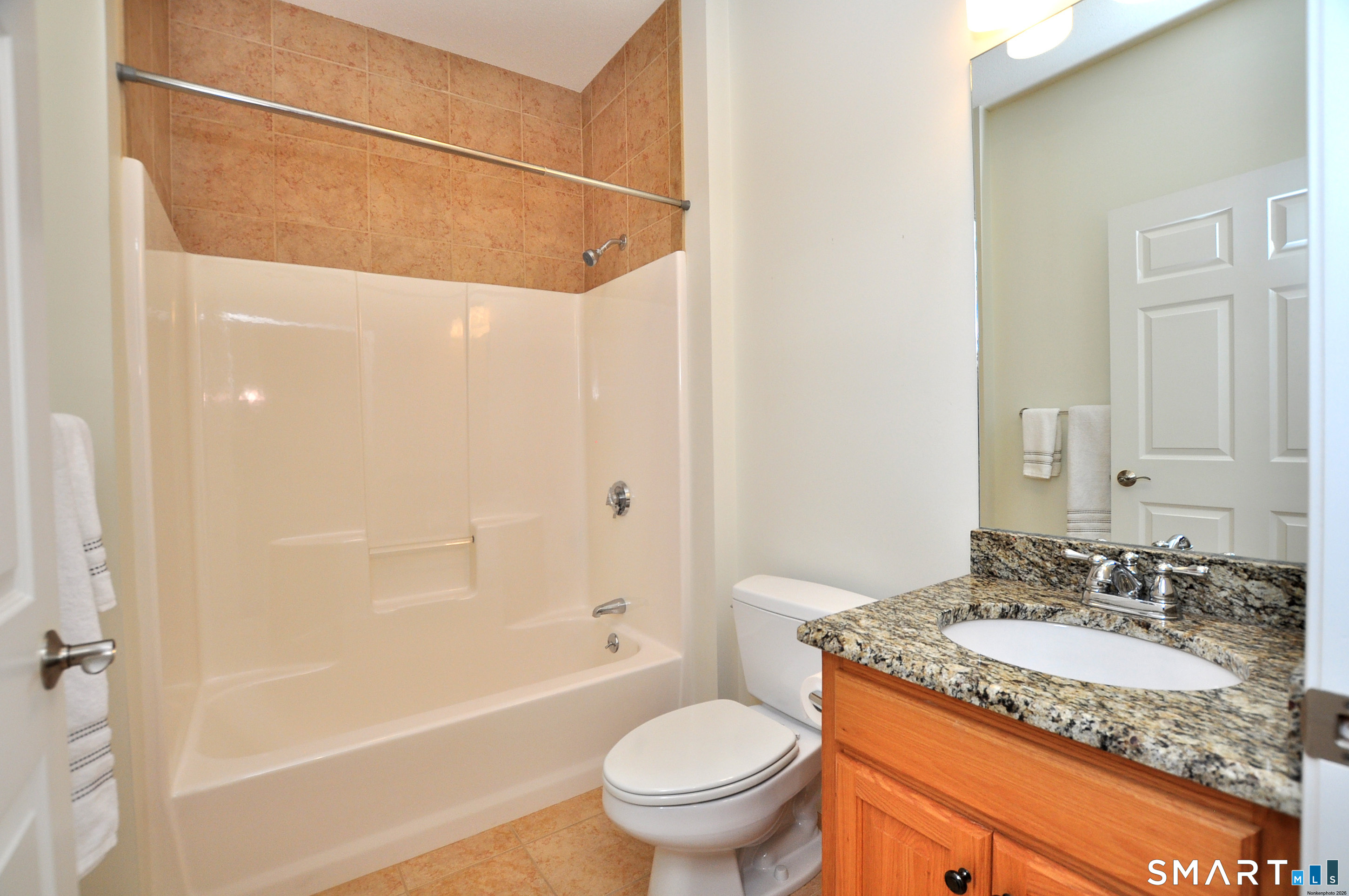 453 Tributary Lane Windsor, CT 06095 - Photo 30 of 37 a bathroom with a granite countertop sink toilet and shower