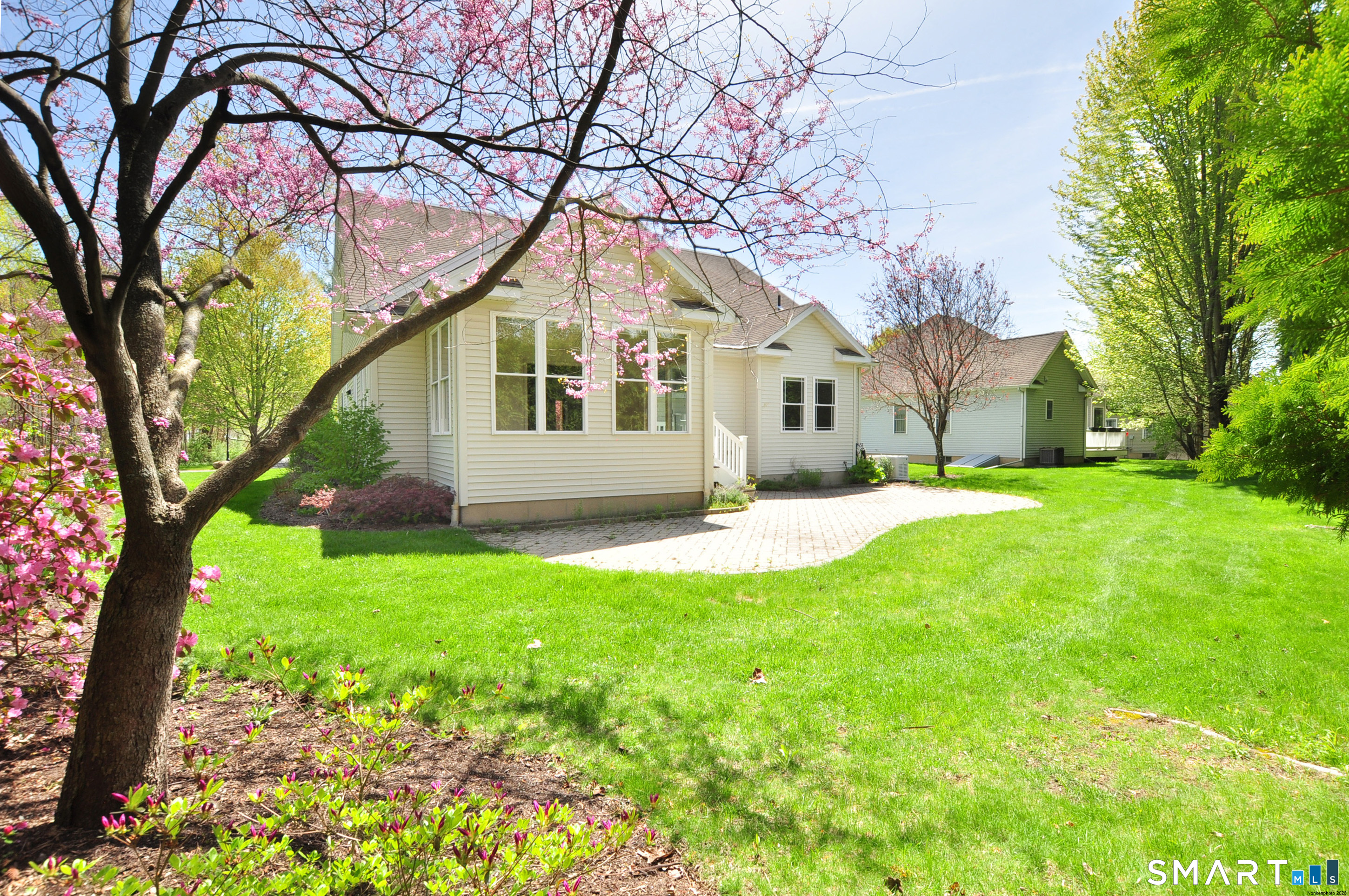 453 Tributary Lane Windsor, CT 06095 - Photo 32 of 37 a front view of house with yard and green space