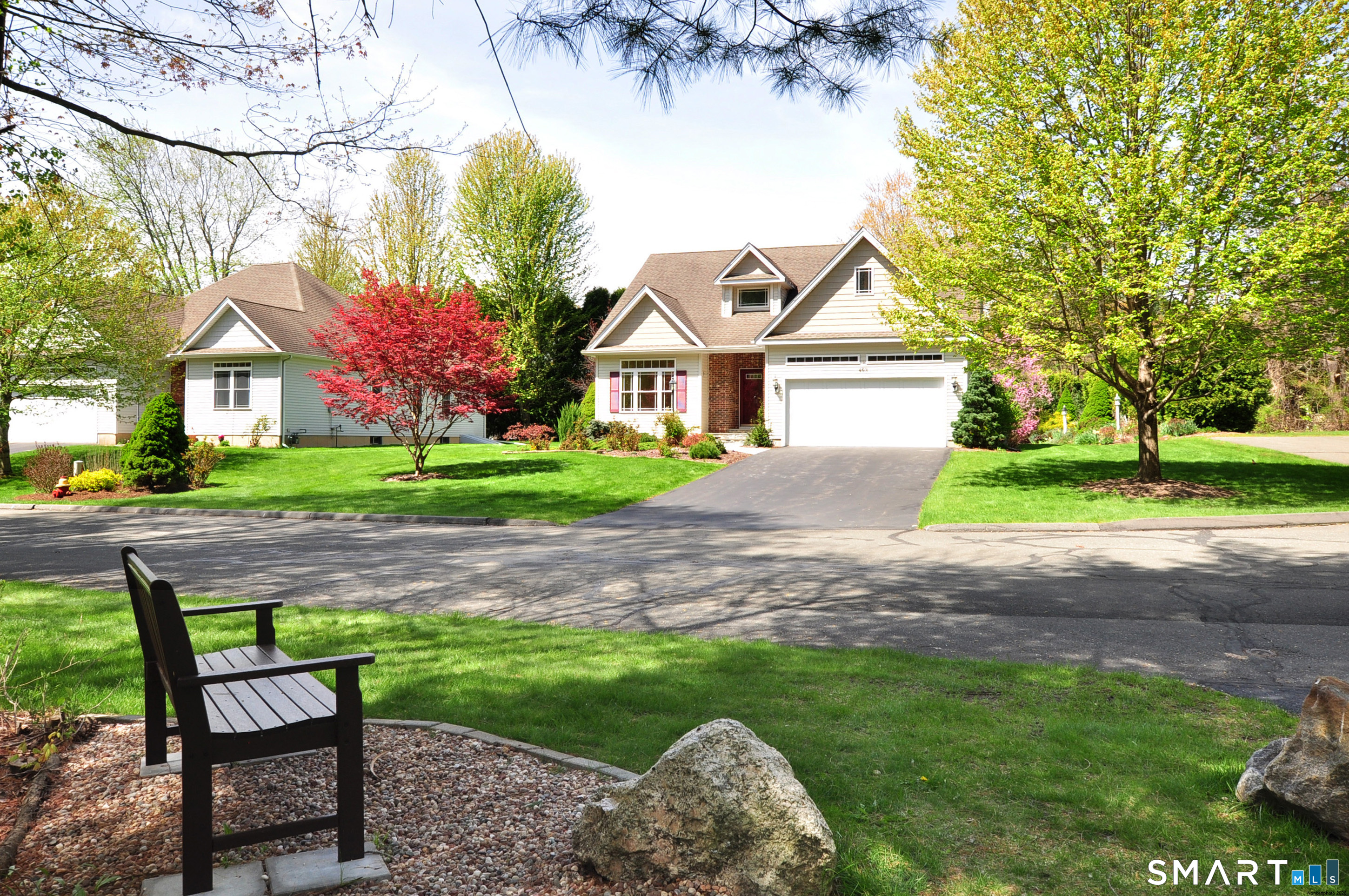 453 Tributary Lane Windsor, CT 06095 - Photo 34 of 37 a front view of a house with a yard and trees