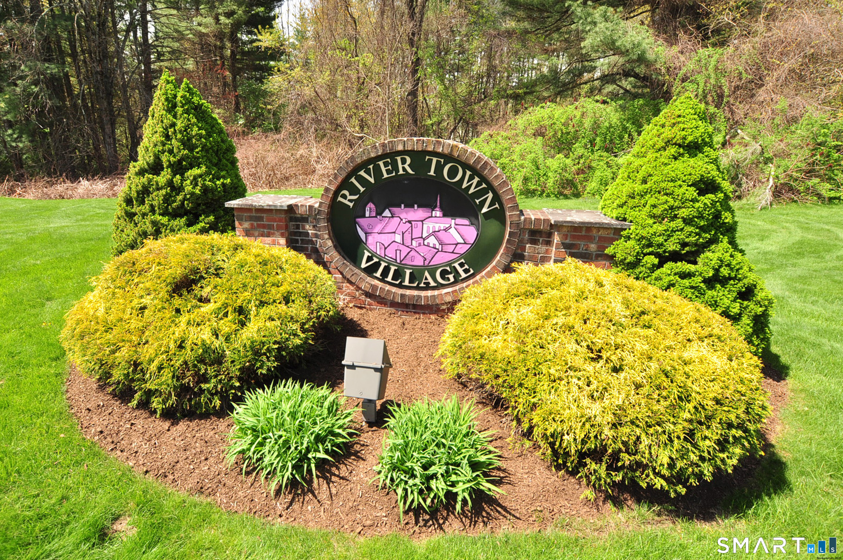 453 Tributary Lane Windsor, CT 06095 - Photo 35 of 37 a sign that is sitting on a wooden floor