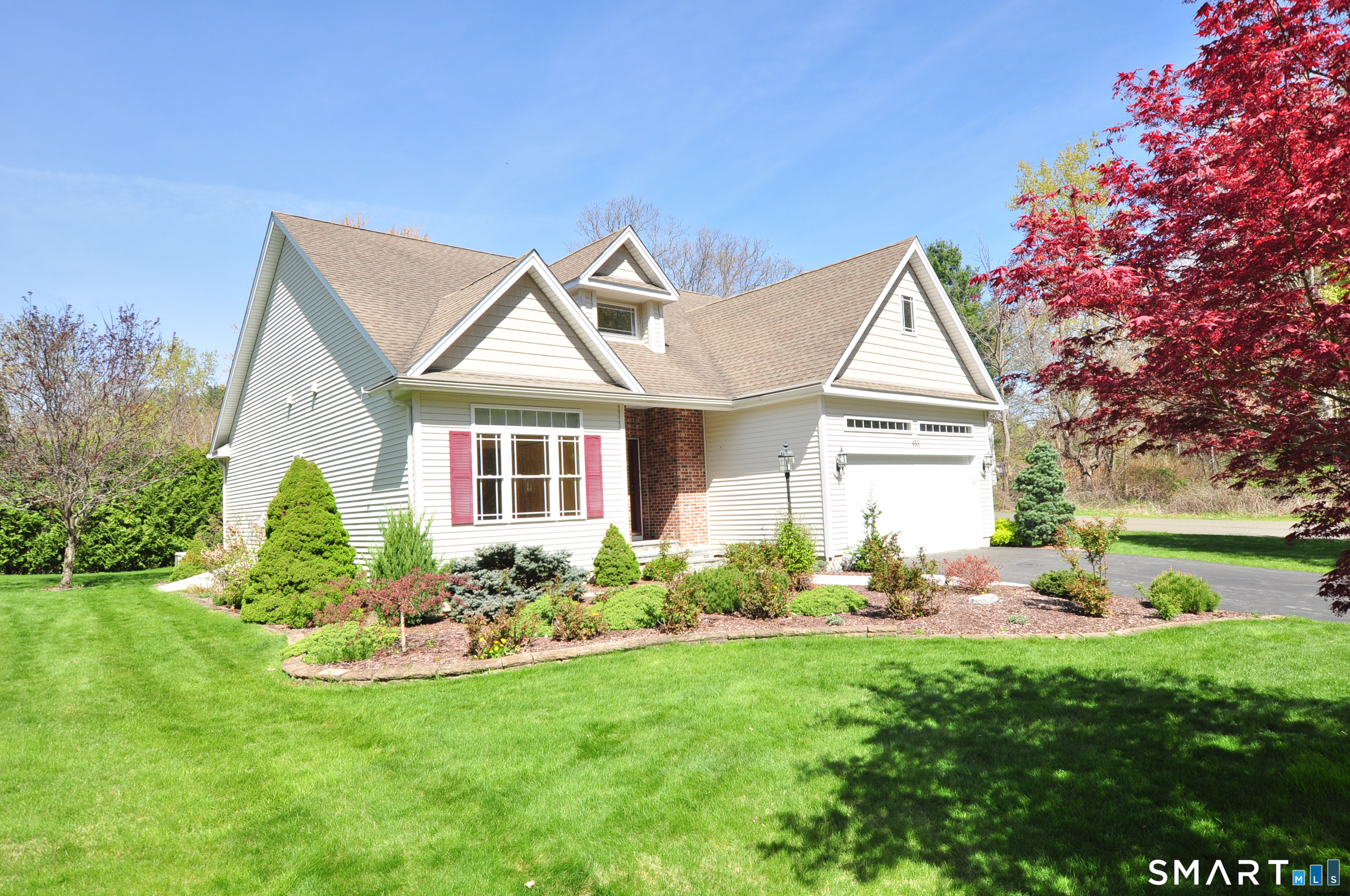 453 Tributary Lane Windsor, CT 06095 - Photo 37 of 37 a front view of a house with garden