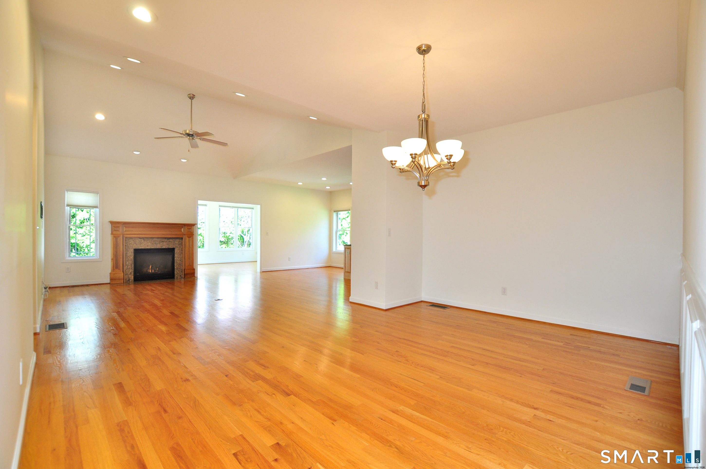 453 Tributary Lane Windsor, CT 06095 - Photo 6 of 37 a view of a room with chandelier wooden floor and windows