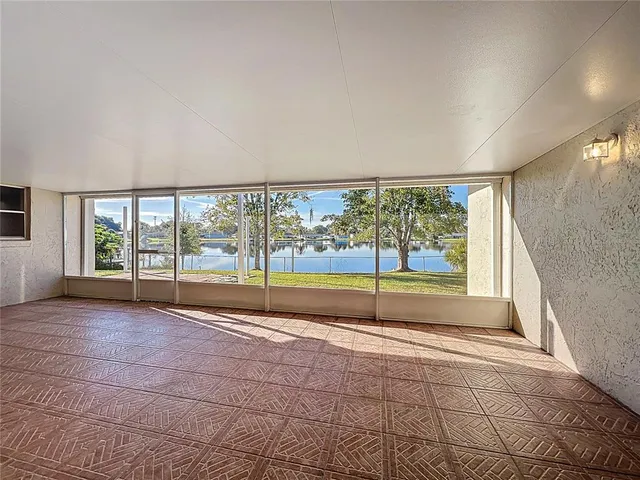 a view of an empty room with a large window