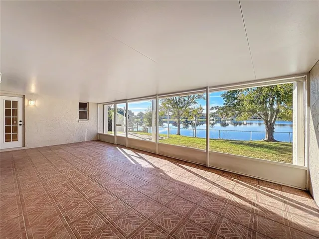 a view of an empty room with a large window