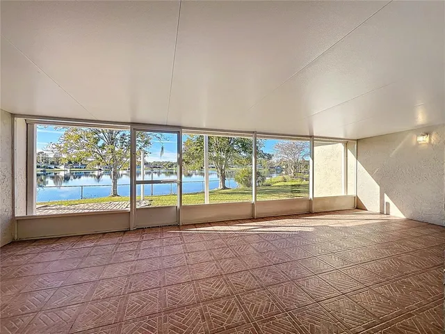 a view of an empty room with a large window
