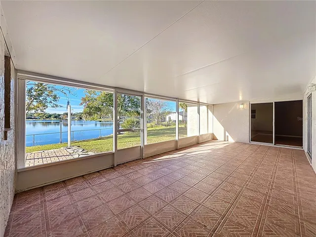 a view of an empty room with a large window