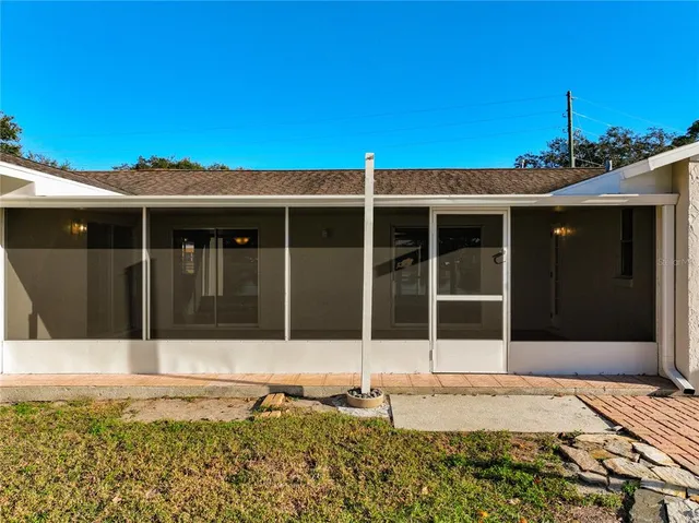 a view of a house with a backyard