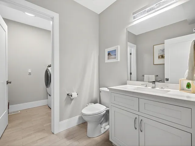 a bathroom with a toilet sink and shower