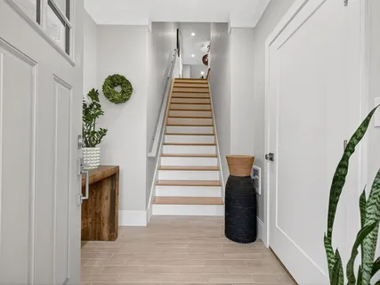 a kitchen with stainless steel appliances granite countertop a sink and a refrigerator