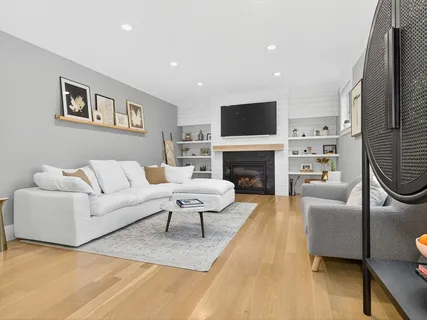 a living room with furniture or couch and a large window